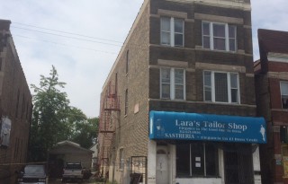 BANK OWNED 8 Unit Brick Building plus additional vacant side lot with Garage in Little Village